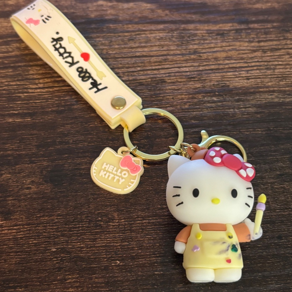 Sanrio Hello Kitty Painter 3D Figure Keychain Wristlet Strap Yellow Overalls